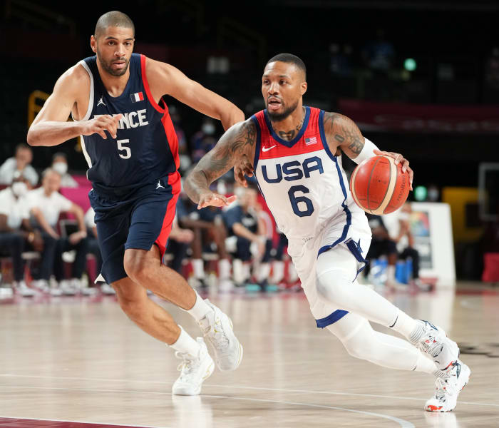 Team USA guard Damian Lillard dribbles past a defender during the 2020 Olympic Summer Games.